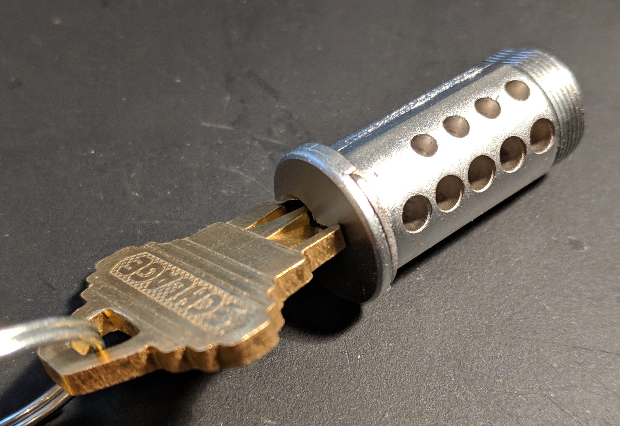 Cylinder from Schlage B60N with a set of construction holes.